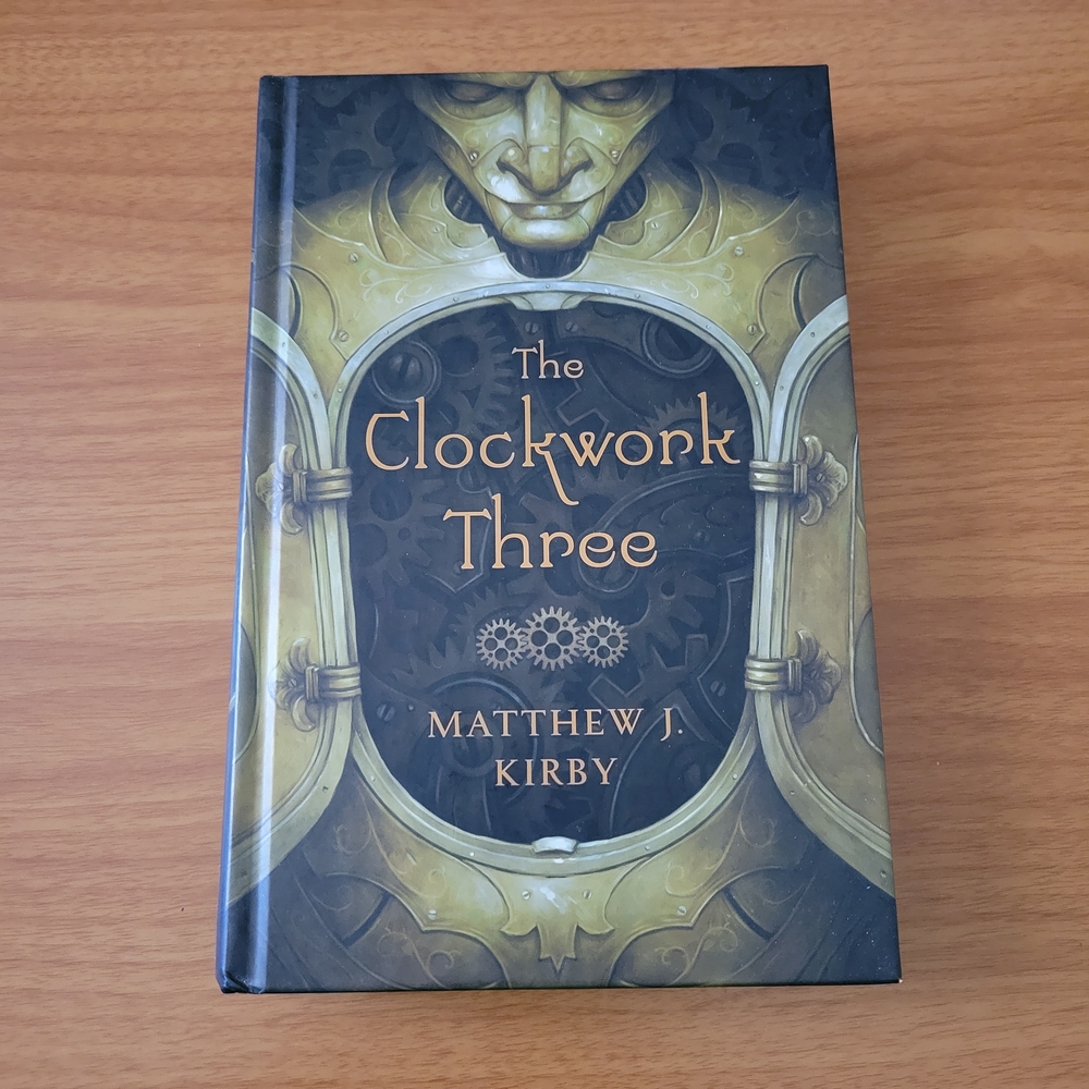 Scholastic The Clockwork Three - Gold and Black Cover